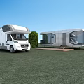 Modern Space Capsule Structure With RV And Glass Walls On Green Grassland