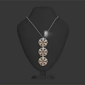 Elegant Three Round Pendant Necklace Displayed On Black Mannequin With Shiny Design