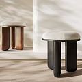 Modern Minimalist Stools With Upholstered Seats Brown And Black Wooden Legs In Soft Light Interior