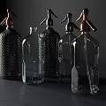 Stylish Ceramic Vessels Featuring Decorative Spray Nozzles And Unique Patterns On Dark Table