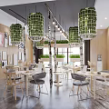Stylish Modern Tea Room Interior With Green Pendant Lights Wooden Walls And Cozy Tables Chairs