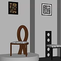 Brown Wooden Chair With Circular Backrest And Black Chair With Hole Design In Gray Room