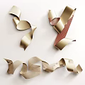 Golden Ribbon Wall Decor with Curled Shapes and Mesh Texture