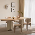 Light Colored Oval Wooden Dining Table And Chairs With Decorative Paintings Green Plant And Rug