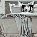 Modern Double Bed in Bedroom Interior with Gray Bedding Decorative Painting and Wall Sconces