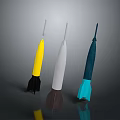 Three Different Colored Rocket Weapons with Yellow White Blue Bodies and Thrusters
