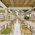 Modern Open Restaurant Interior With Yellow Green Pendant Lights Wooden Tables And Chairs Glass Dividers