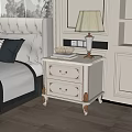 Elegant White Bedside Table with Gold Accents Two Drawers Lamp Books and Decorative Bowl