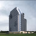 Modern High Rise Hotel Building With Glass Facade And Green Landscape