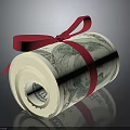 Rolled US Dollar Bills Tied With Red Ribbon On Dark Surface