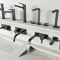 Various Modern Faucet Styles Mounted On White Countertop With Flowing Water