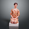 Child Sitting On White Block Wearing Floral Dress Against Gray Background