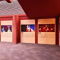 Cultural Exhibition Display With Red Walls And Featured Images With Text