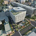 Modern Hospital Building Architectural Design In Urban Aerial View With Green Spaces