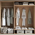 Wooden Wardrobe Interior With Hanging Robes Folded Towels And Storage Baskets