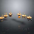 Small Wooden Spinning Tops With Colorful Bases On Black Reflective Surface