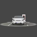 White Tesla SUV Electric Car Charging At Tesla Charging Station In Parking Lot