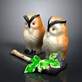 Two Ceramic Owl Figurines With Brown Feathers And Green Leaf Decor