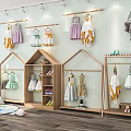 Cute Children's Clothing Store With Hanging Dresses Wooden Racks Wall Decor And Green Plants