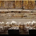 Luxurious Banquet Hall Interior With Golden Chandeliers Decorative Leaves And White Flowers