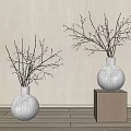 White Ceramic Vases With White Flowering Branches On Wooden Cubes Against Light Wall