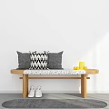 Sunlit Indoor Space With Wooden Bench Cushions White Shoes Gray Rug Yellow Cup And Oranges