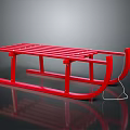 Red Wooden Sleigh With Slatted Seat And Metal Runners On Reflective Black Surface