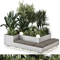 Outdoor Concrete Chair With Gray Cushions Surrounded By Green Plants And Round Lights