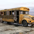 Old Yellow School Bus With Rusted Body On Icy Ground Under Cloudy Sky