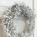 Decorative Wreath With Green Leaves Blue Berries And String Lights Hanging On Worn Wooden Wall