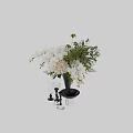 Decorative Ornament Set Featuring White Orchids Hydrangeas Ferns Black Vase Glass Goblets And Silver Bowl