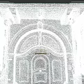 Residential Building Entrance Featuring Arched Wooden Doors Stone Statues And Classical Design