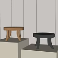 Modern Wooden and Black Stools on Display Stands in Minimalist Interior
