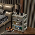 Modern Bedside Table With Drawers Near Beige Sofa Bed And Table Lamp Radio