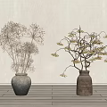 Gray and Brown Clay Vases Holding Dried Plants and Yellow Flower Branches Against Light Wall
