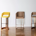 Modern Upholstered Bar Stools with Metal Frames in Yellow and Brown Tones