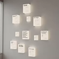 Modern Minimalist Square White Wall Lamps Illuminated On Gray Wall With Multiple Sizes