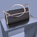 Stylish Dark Brown Handbag With Beige Decorative Stripes And Handles On Gray Table