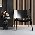 Stylish Black Casual Sofa Set With Vertical Striped Walls Marble Table And Arched Art Decorations