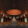 Buddhist Temple Interior With Buddha Statue Wooden Ceiling Circular Red Decoration And Prayer Benches