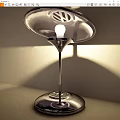 Sleek Modern Table Lamp With Transparent Lampshade Silver Base And Warm Glow