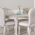 Elegant White Dining Table Set With Floral Chairs Hanging Lamp And Vase On Wainscoting Wall