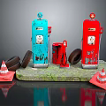 Vintage Blue And Red Fuel Pumps With Rusty Tire And Traffic Cones On Stone Base
