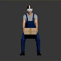 Person In Blue Overalls Wearing VR Headset Carrying Cardboard Box On Gray Background