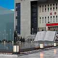 Scenic Square Landscape With Central Fountain Pool Red Flags On Flagpoles And Paved Ground