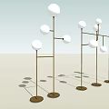 Modern Floor Lamps With Spherical White Shades And Metal Bases In Interior Setting