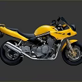 Yellow Sporty Motorcycle With Streamlined Design And Black Seat Metallic Wheels And Exhaust System