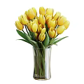 Beautiful Yellow Tulips in Transparent Glass Vase with Fresh Green Leaves Bouquet Arrangement
