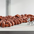 Minimalist Brown Braided Abstract Sofa In Modern Space With Silver Sculpture