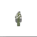 White Flowers In Transparent Glass Vase With Green Stems And Elegant Design